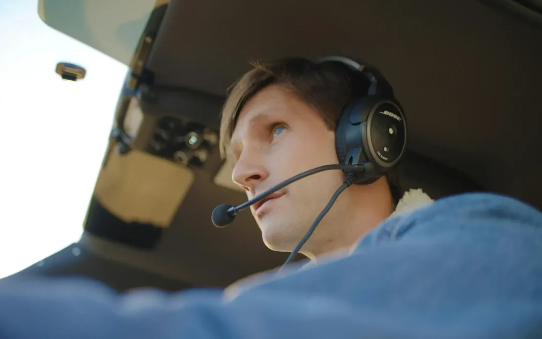 Pilot wearing headset in an airplane cockpit during ATP-CTP training