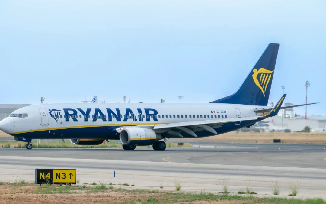 A Boeing 737 taxiing on the runway at an airport.