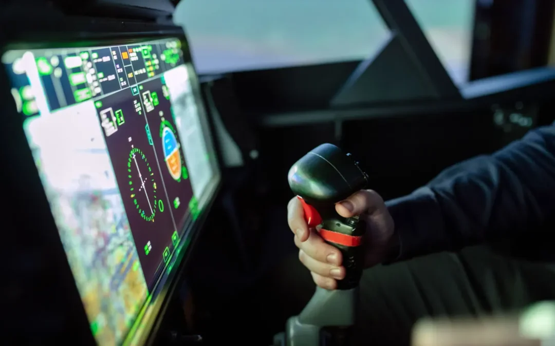 Pilot operating controls in a real flight simulator cockpit